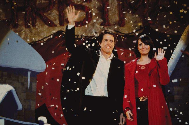 Quality: Original.  Film Title: Love Actually.  Pictured: THE PRIME MINISTER (HUGH GRANT), NATALIE (MARTINE McCUTCHEON).      Photo Credit: © Peter Mountain.  Copyright:  © 2003 Universal Studios. ALL RIGHTS RESERVED.