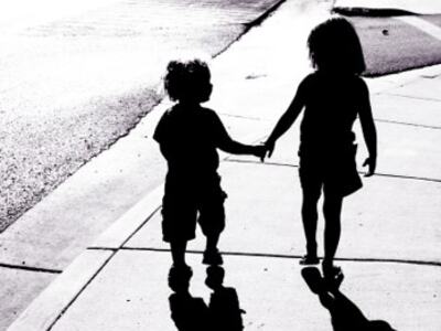 adorable-children-silhouettes-boy-and-girl-holding-hands-picture-id121351839-f