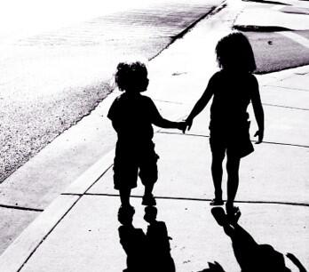 adorable-children-silhouettes-boy-and-girl-holding-hands-picture-id121351839-f