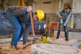 constructions workers drilling concrete