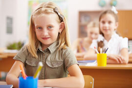 Little girl at school class