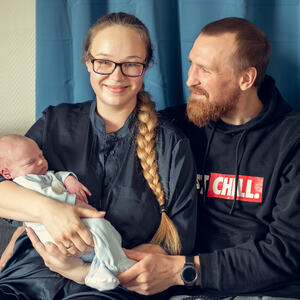 Foto av mor, far og baby