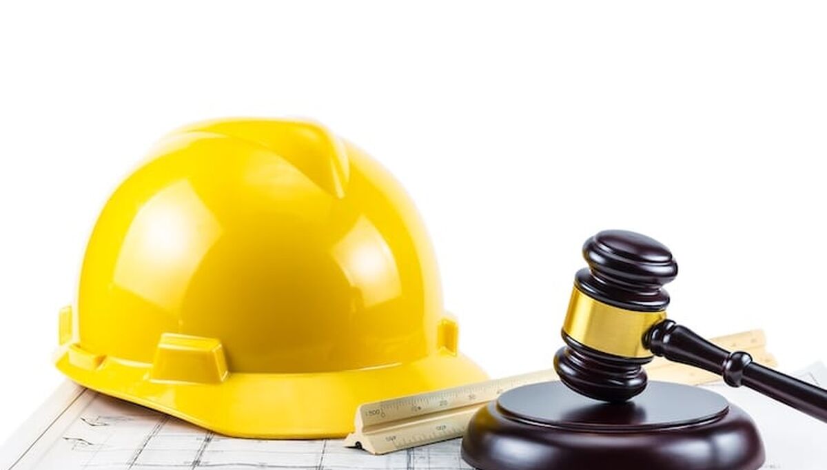 a-photo-of-gavel-and-yellow-safety-helmet-on-isolate-white-background-concept-idea-law-about-constr