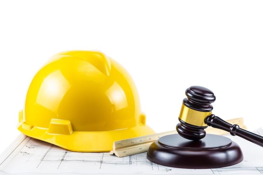 a-photo-of-gavel-and-yellow-safety-helmet-on-isolate-white-background-concept-idea-law-about-constr