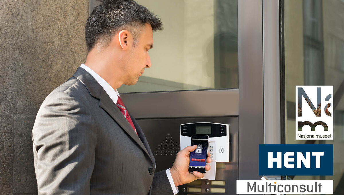 businessman-disarming-security-system-of-door-with-smartphone