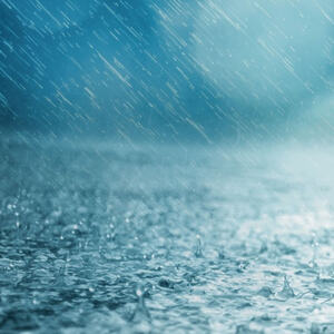 Foto av regn mot grunn