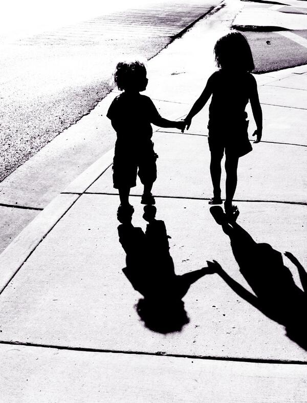 adorable-children-silhouettes-boy-and-girl-holding-hands-picture-id121351839 (2)
